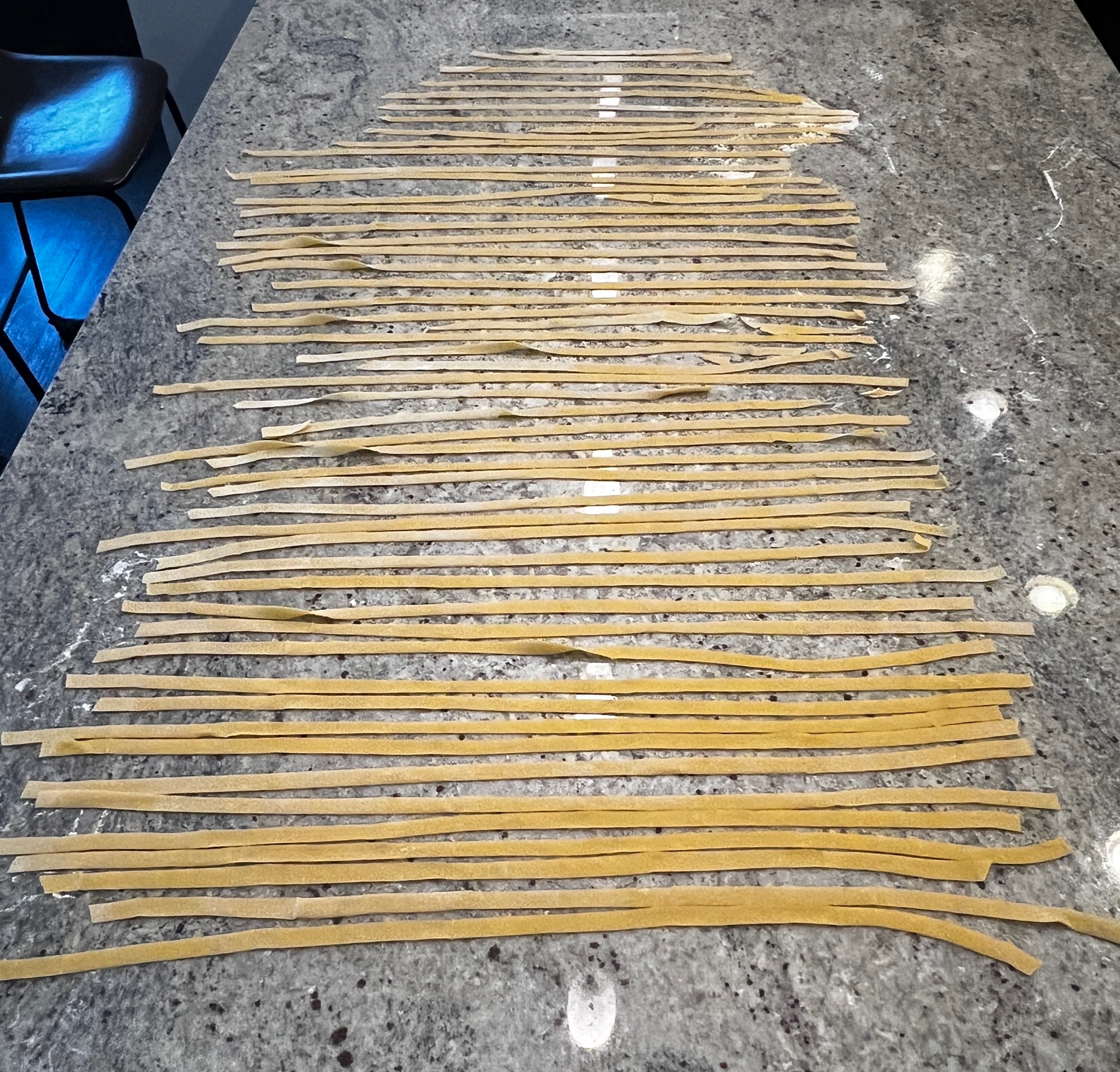 A group of thin noodles on a counter

AI-generated content may be incorrect.